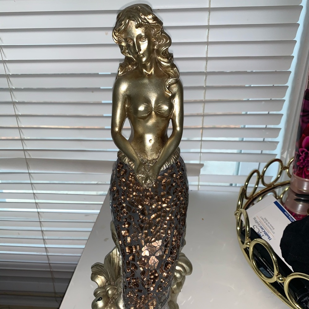 Gold mermaid statue